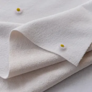 Soft white thickened hug fleece fabric with delicate daisy floral pattern detail