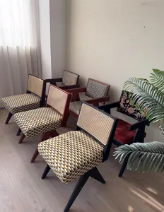 Detailed view of vintage Mid-century jacquard and chenille upholstery fabrics on chairs