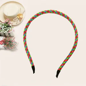 Detailed view of colorful PU leather braided headband in red, green, and blue for children.