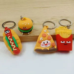 Close-up of cute cartoon food keychains featuring hamburger, pizza, fries and hotdog