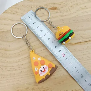 Detailed view of cute cartoon food keychains with ruler showing hamburger and pizza size.