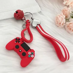 Detailed macro shot of red PVC game controller keychain with wrist strap