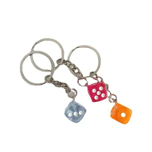Vibrant set of three colorful acrylic dice keychains for creative bag decoration and DIY gifts