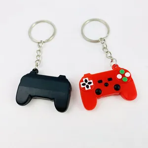 Detailed view of miniature game controller keychains in vibrant red and classic black