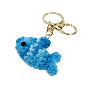 Hand-crocheted blue marine fish keychain pendant with golden metal ring for school backpacks