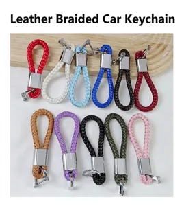 Macro view showing 11 colors of braided leather car keychains with horseshoe buckles
