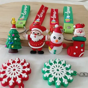 Vue détaillée de mignons porte-clés de Noël en silicone 3D avec figurines du Père Noël