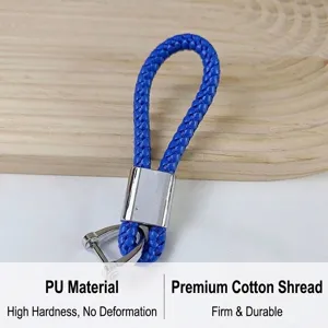 Detail showing blue braided PU leather keychain with a sturdy silver horseshoe buckle