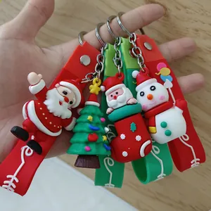 Collection de quatre porte-clés de Noël colorés en silicone 3D avec pendentifs de fête