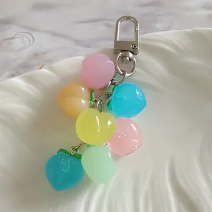 Macro detail of colorful translucent silicone heart charms attached to a silver metal keychain