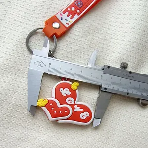 Macro view of red heart keychain width measured by a metal vernier caliper tool