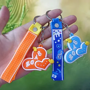 Close-up of vibrant 3D silicone heart keychains with embossed textures and wrist straps