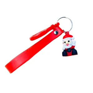 Cute Santa Claus keychain featuring red silicone wrist strap and cartoon Christmas charm