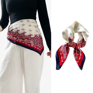 Detailed view of navy blue paisley silk scarf styled as a fashionable waist belt accessory