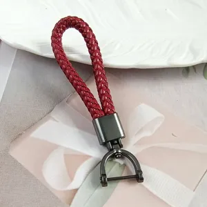 Minimalist red braided leather keychain strap with a durable gunmetal horseshoe buckle.