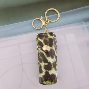 Stylish leopard print PU leather lipstick case keychain with gold clasp attachment