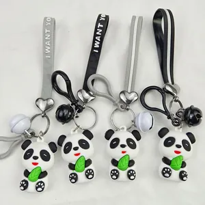 Detailed view of four cute PVC panda keychains with 'I WANT YO' straps and bells
