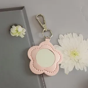 Pink flower-shaped PU leather keychain with built-in portable makeup mirror