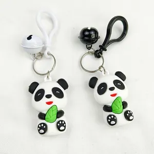 Detailed view of two cute cartoon panda keychains made of soft PVC with bells