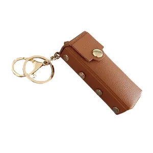 Étui à rouge à lèvres portable en cuir marron avec porte-clés doré élégant