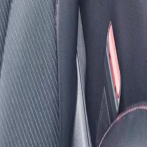 Macro close-up detail showing the car seat fabric texture and red buckle component for pet travel carrier
