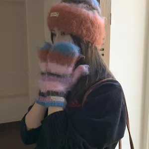 Colorful fuzzy knit hat and mittens set with soft mohair texture for winter warmth.