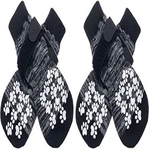 Close-up detail of anti-slip knit dog socks with adjustable Velcro straps and paw prints
