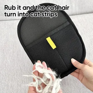 Detail view of a black mesh pet hair removal tool showing efficiency with collected fur