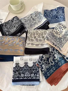 Assorted paisley printed silk scarves for women in elegant color palettes.