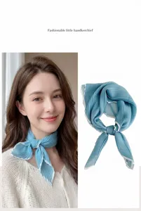 Close-up detail of a light blue pleated decorative neck scarf with white contrast piping