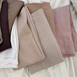 Collection of soft cotton-feel crinkle square scarves with natural pleated texture detail