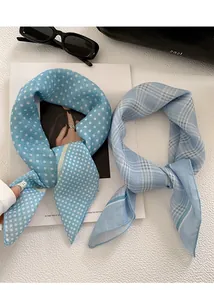 Detailed macro shot of blue polka dot and plaid breathable cotton square scarves