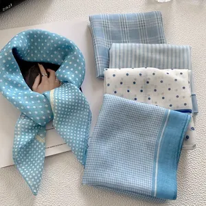 Elegant blue patterned headscarves including polka dots and plaid for women's spring fashion