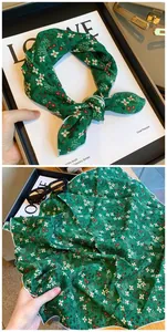 Detailed view of dark green floral print cotton square scarf for hair and neck styling