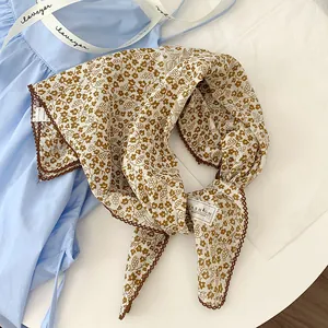 Detailed view of floral printed cotton square scarf with decorative lace border