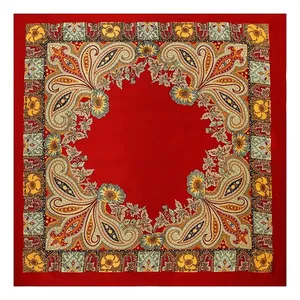 Full view detail of a square satin scarf with intricate red paisley and floral border