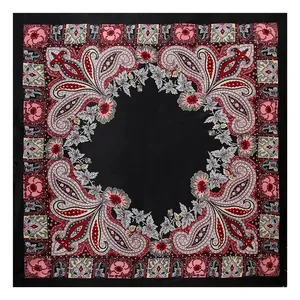 Detailed flat lay of a satin paisley printed silk-like square scarf in black and red