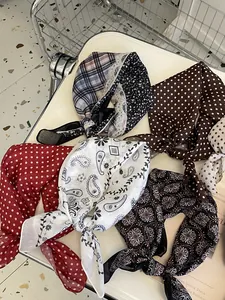 Assorted 58cm cotton linen neckerchiefs in paisley and polka dot patterns.