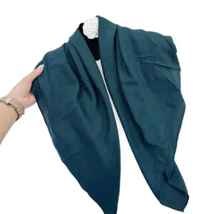 Elegant forest green crinkled square scarf with soft cotton-like texture for women.