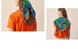 Detail view of Van Gogh Irises silk square scarf worn as a hair accessory and wrap