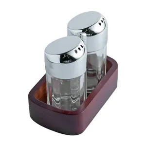 Nordic style seasoning shaker set with acrylic jars and a dark solid wood base holder