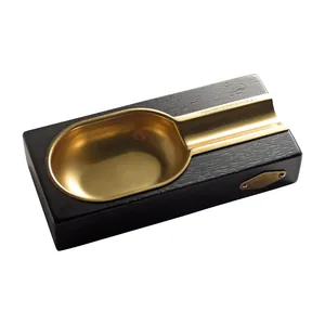 Luxury cigar ashtray featuring a black wood grain base and gold metal alloy cigar rest