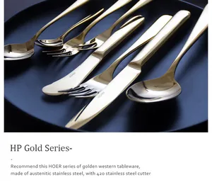 Close-up detail of golden HOER series stainless steel cutlery with a luxury polished finish