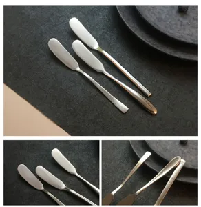 Close-up of high-quality stainless steel butter knives with engraved handle details