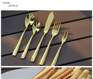 Close-up detail view of golden hammered stainless steel cutlery set on a wooden table