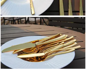 Detailed view of gold-plated hammered texture stainless steel cutlery set on a white plate