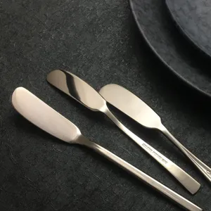 Set of three premium 18/10 stainless steel butter knives spreaders on dark stone
