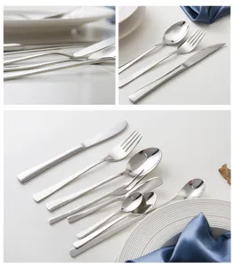 Detailed view of polished stainless steel cutlery set with knife fork and spoons
