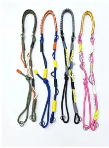 Detail view of four colorful hand-woven adjustable phone lanyards in various colors