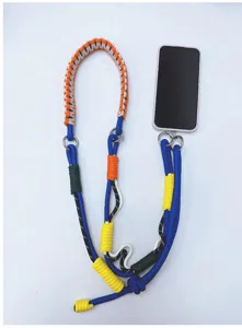 Handmade colorful braided paracord phone lanyard with metal rings on white background